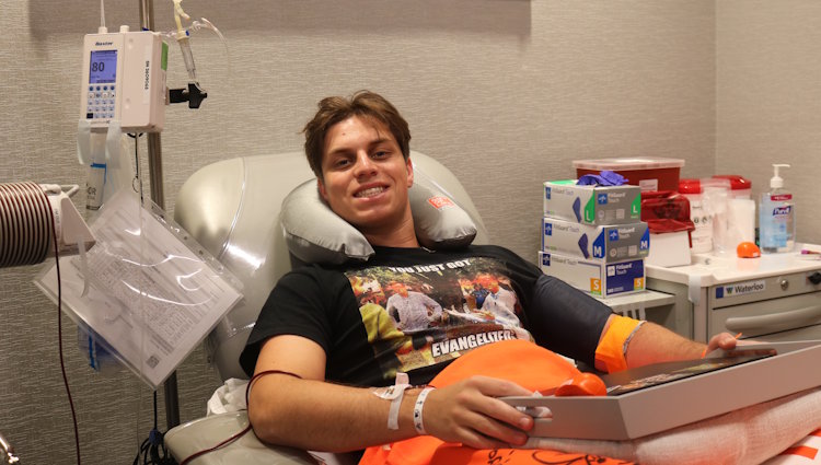 Gift of Life stem cell donor Matthew is shown in the collection center donating peripheral blood stem cells to help save the life of a man with blood cancer.