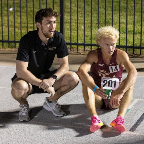 Jacob (left) is a Gift of Life Marrow Registry volunteer blood stem cell donor, who saved a woman's life in 2023 by donating cells for transplant to defeat leukemia. He works as an athletic trainer at Florida State University, and is shown here at a track meet coaching an FSU team member. 