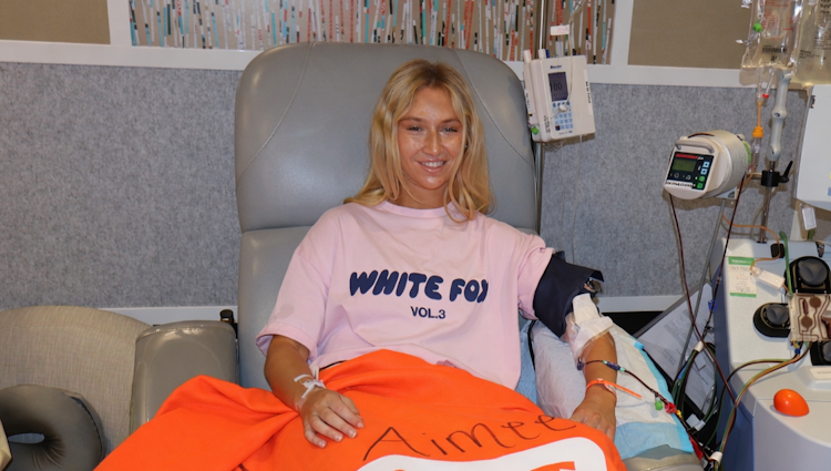 Aimee is a Gift of Life stem cell donor shown at the collection center giving peripheral blood stem cells to save the life of a man with leukemia.