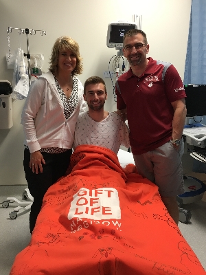 Accompanied by his proud parents, Aaron prepares to donate bone marrow to give a young boy with blood cancer a second chance at life.