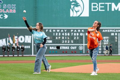 Gift of Life marrow donor Leah McNeil (l) and her transplant recipient Kayce Moose step up to the mound to throw out the first pitch at the Boston Red Sox game on April 23, 2025. The Red Sox arranged for the two women to meet in person for the first time as part of their 7-year partnership with the Gift of Life Marrow Registry. Marrow donors and their recipients may not learn each other's identities for the first year after the transplant.   