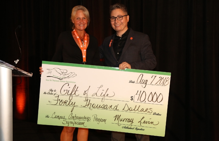 Vice President of Charitable and Corporate Communications of The Saul and Theresa Esman Foundation Katie Boeck presented Jay Feinberg with a check for $40,000.