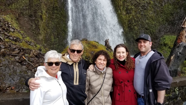 Marrow donor Liza Abrams (red coat) visits Multnomah Falls with her transplant recipient Jack (left), his wife Phyllis (far left), Liza's mother Amy (center), and her fiance Garrick (right).