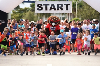 FAU mascot Owlsley helps kick off the Superhero Sprint.