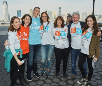 Bone marrow transplant Recipient Melissa Scheinberg (orange shirt) met her donor David Allen (blue shirt) at the Gift of Life Marrow Registry Steps for Life 5K in October 3016.