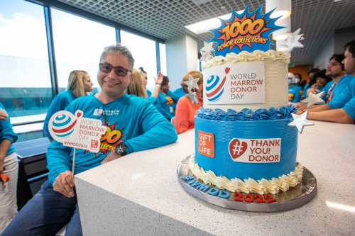 In 2022, Gift of Life Marrow Registry celebrated the 1000th donor collected at the organization's in-house stem cell collection center for World Marrow Donor Day. Posing here is CEO Jay Feinberg with the traditional WMDD theme cake. 