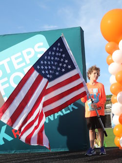 Brian Greenspon presented the colors as the Park Vista High School Marching Band (not pictured) played the National Anthem to open the Steps for Life 5k Run and Walk. 