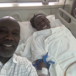 Lifesaving stem cell donor Frank Abbott and his dad at the collection center on the day he donated cells to save Rashawn's life.