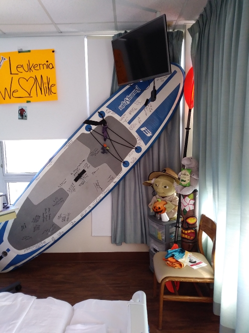 Mike Magi's family and friends brought his paddleboard and other tropical deco to his hospital room during treatment for leukemia. 