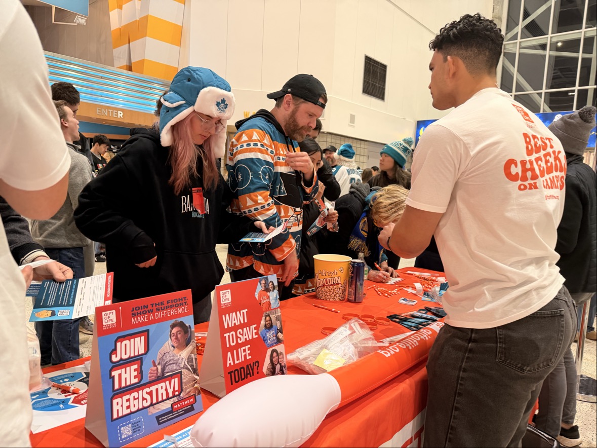 A long line formed at Gift of Life's swabbing table at the San Jose Sharks game after the donor-recipient introduction as fans were excited for their chance to save someone's life. 