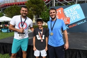 Top finishers Caleb Berman (C) in first place, Georgios Loundaros (R) second, and Anderson Nunes (L) third. 