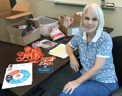 Dale McCutcheon volunteers at Gift of Life's headquarters organizing drive supplies.