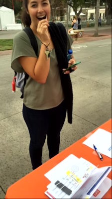 Marrow donor Avery Barth is shown swabbing her cheek to join Gift of Life Marrow Registry at a donor recruitment drive on the USC campus in 2016.