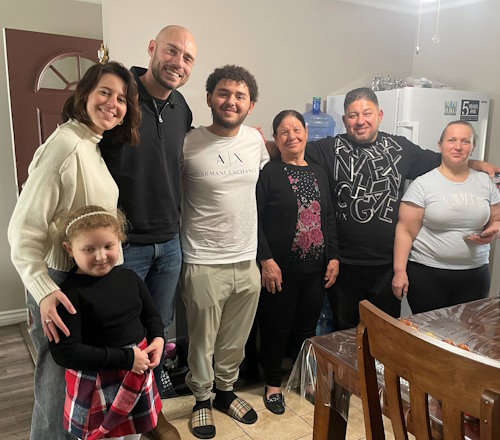 Gift of Life stem cell donor Bobby Alexis with his recipient Aidan Samoon (center) surrounded by Aidan's family and Bobby's girlfriend, Caroline. This is their first in-person meeting more than a year after the transplant was completed. Transplant donors and recipients must remain anonymous for the first year under federal regulations. 