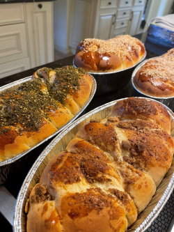 Baked challah loaves in different flavors fresh from the oven, baked by Gift of Life volunteer Cayla Noorani. 
