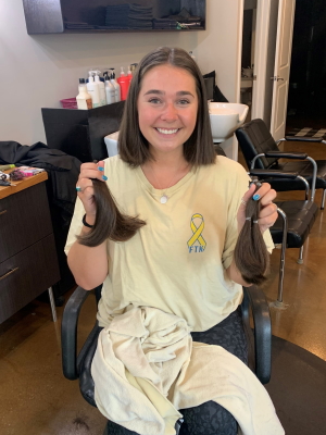 Stem cell donor Nora donated hair to make wigs for children with cancer during the University of Delaware Dance Marathon.