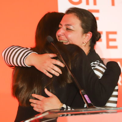 Leukemia survivor Anahita Yazdgerdi (r) embraces her lifesaving stem cell donor Rachel Barron as the two meet for the first time. 