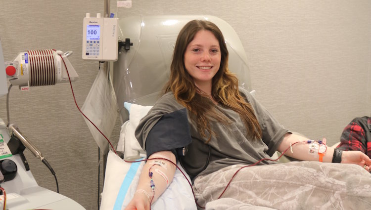 Gift of Life stem cell donor Ashley is shown during the donation process as her cells are collected. Ashley is all smiles during the procedure as she is giving a woman diagnosed with lymphoma her best chance of a cure. 