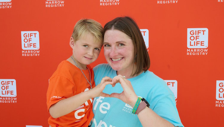 Marrow transplant recipient 5-year-old Dawson Lankford met his heroic donor Betty Resnick for the first time at the Miami Beach 'Battle of the Badges' event.  