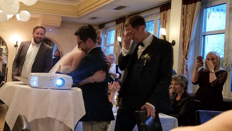 Transplant recipient Christopher Salz (r) is overcome with emotion upon meeting Adam Tornheim (c) the man who saved his life. Maike, the bride, hugs Adam.